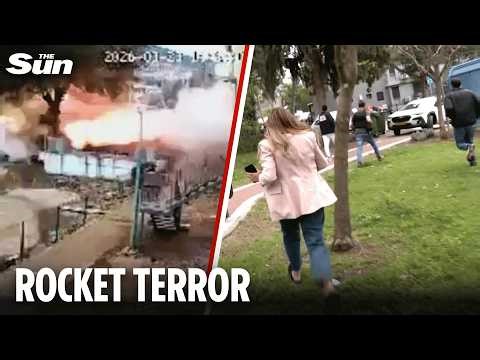 Terrifying moment Hezbollah rocket smashes into Israeli border town as journalists run for cover