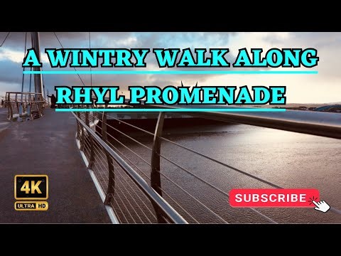 A WINTERS WALK along the promenade at RHYL NORTH WALES 