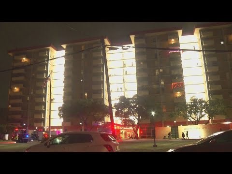 Officials say high-rise apartment fire near downtown was started by cigarette on coffee table