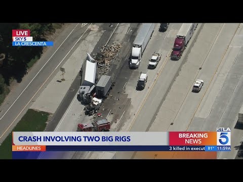 Crash involving 2 big rigs sends boxes spilling onto 210 Freeway