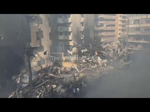 Buildings in central Beirut reduced to smoldering rubble by deadly barrage of Israeli airstrikes