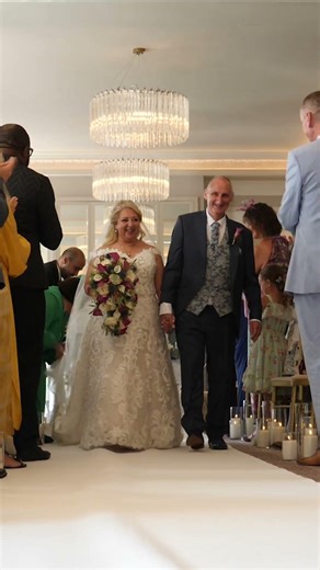 Bride and Groom walk up the aisle