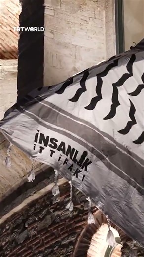 Istanbul’s Galata Tower draped with Palestinian keffiyeh