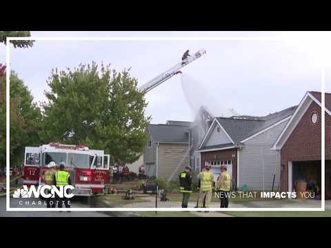 Roof collapses in Charlotte house fire, trapping two firefighters