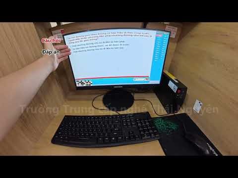 Instructions on how to operate the computer on the driver's license theory test software.