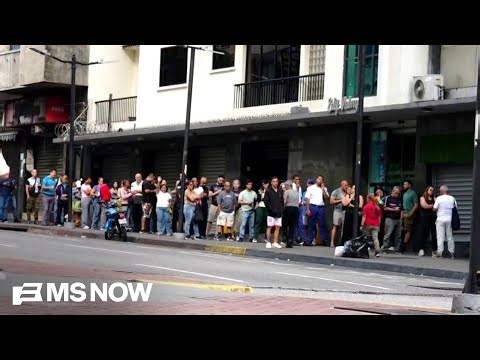 Venezuelans line up for food, gas as future becomes uncertain following Maduro ousting