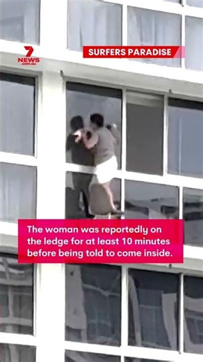 Fearless window washer spotted 16 floors above the ground at Surfers Paradise on the Gold Coast