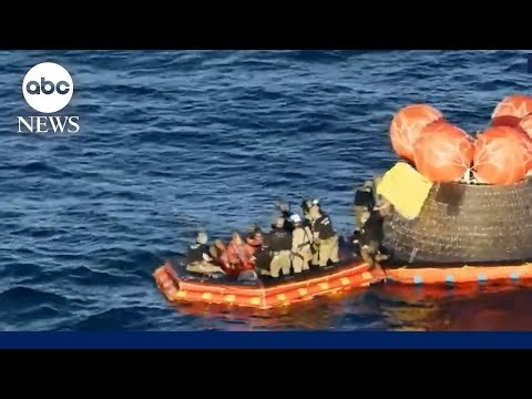 Astronauts exit spacecraft after successful splashdown