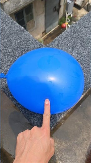 Experiment: Will a water balloon explode if it rolls down a tall building? 💥🎈 #balloon