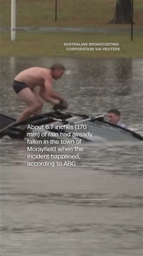 Australian reporter rescues man from sinking car