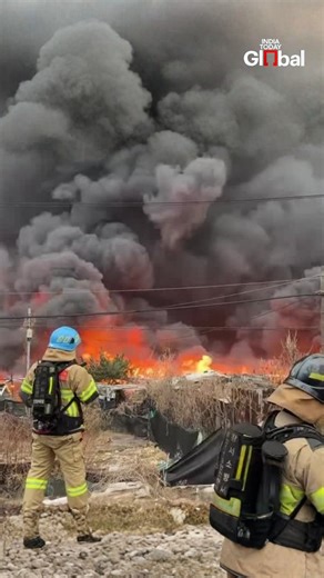 Nearly 300 firefighters and 85 fire trucks are battling a major blaze in Guryong Village, a low-income area in Seoul’s wealthy Gangnam district. No casualties have been reported so far, but authorities evacuated 47 residents as smoke and flames threatened nearby areas. Redevelopment plans for high-rise buildings add urgency to containment efforts. #Seoul #GangnamFire #GuryongVillage #SouthKorea #IndiaTodayGlobal | India Today