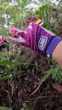 Dirt Bike Riders Tangle and Fall on a Muddy Trail