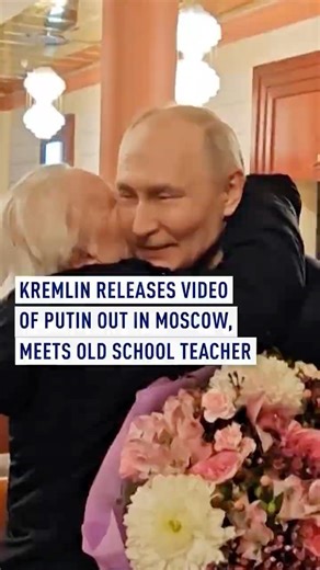 Kremlin releases video of Putin out in Moscow, meets old school teacher