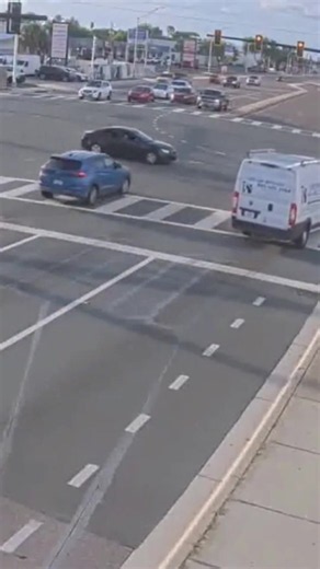 A red light runner missed a car by inches as he drove through an intersection in Florida. Traffic camera footage shared by the Sarasota Policement Department shows the blue car failing to stop at the intersection at 12th Street on Saturday (13 June).