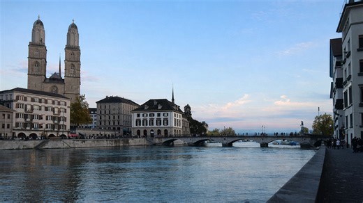 Zurich river walk past the Grossmünster towers