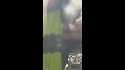 Midtown high-rise fire sends thick smoke over Manhattan skyline in New York, USA