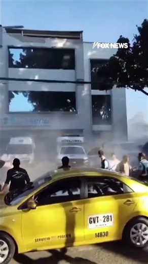 People FLEE as earthquake in Colombia sends debris CRASHING into ambulance #shorts #earthquake #news