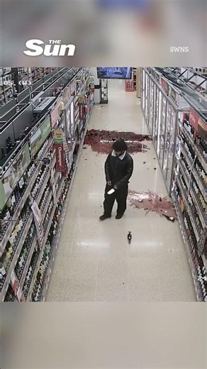 Moment knife-wielding migrant smashes bottles in Morrisons with blade as terrified shoppers flee