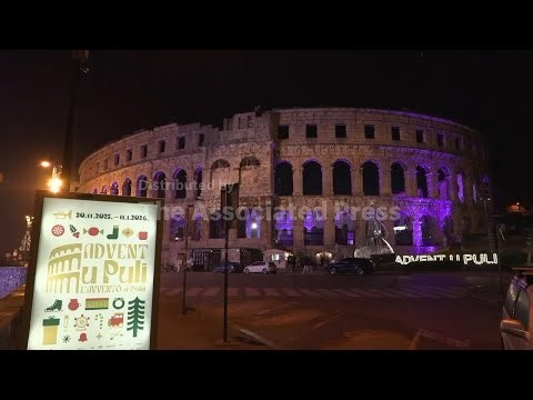 Roller skaters enjoy Christmas ice rink in an ancient Roman amphitheatre