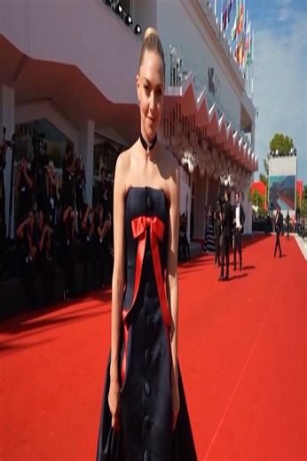 Amanda Seyfried Stuns in Navy & Red Bow Gown at Venice
