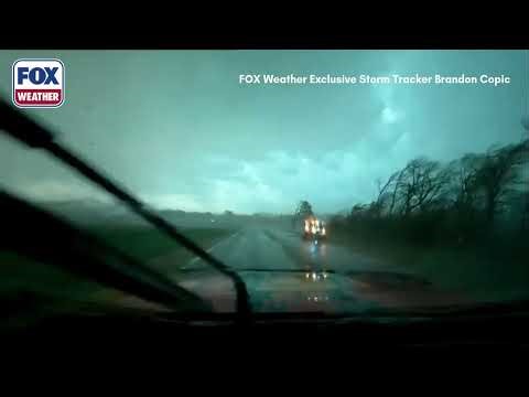Debris Flies As FOX Weather Storm Tracker Drives Through Tornado In Illinois