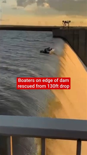 This is the moment four men were rescued from boat at it teetered precariously on the edge of a 130ft drop off the side of a dam. National Sea Rescue Institute (NRSI) crews were dispatched to the Grootdraai Dam in Mpumalanga, South Africa, on Monday (29 December) after the boat suffered motor failure and drifted toward the edge of the spillway as millions of gallons of water thundered over the side of the dam wall. | The Independent