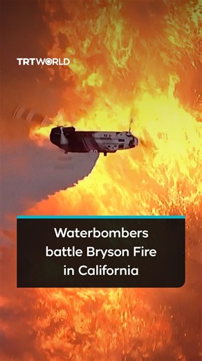 Waterbombers battle Bryson Fire in hills of Malibu, California