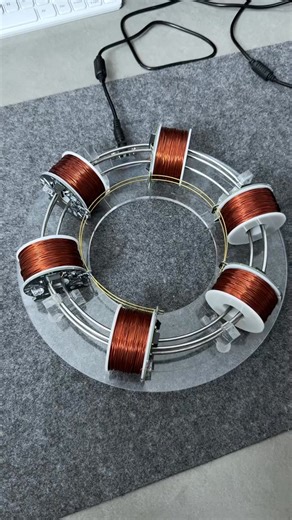 Check out this mini - particle accelerator model! It’s a fascinating piece of science - inspired craftsmanship. Just like in a real - life particle accelerator, where multiple coils work in sequence to give particles a boost, this model mimics that concept with its copper - wound coils. The precision and design are truly eye - catching. It’s not just a model; it’s a glimpse into the amazing world of particle physics. Who else is as intrigued by the wonders of science as I am? #ParticleAccelerato