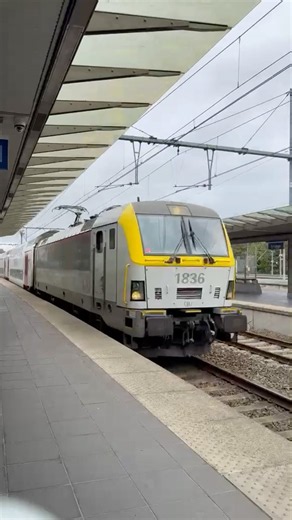1836 SNCB Class 18 InterCity passenger train stopping at Bruges station