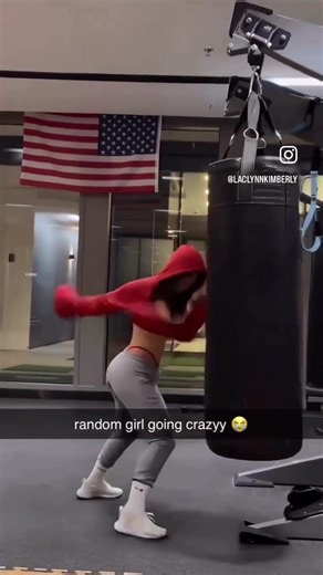 Random girl going crazy on the heavy bag.