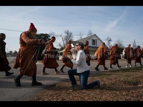 Buddhist monks and their dog captivate Americans while walking for peace