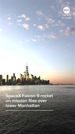 A SpaceX Falcon 9 rocket on its way to the International Space Station flew over the One World Trade Center before sunrise in New York City.