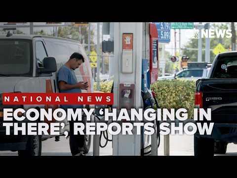Economy 'hanging in there' as reports show slow growth, rising inflation