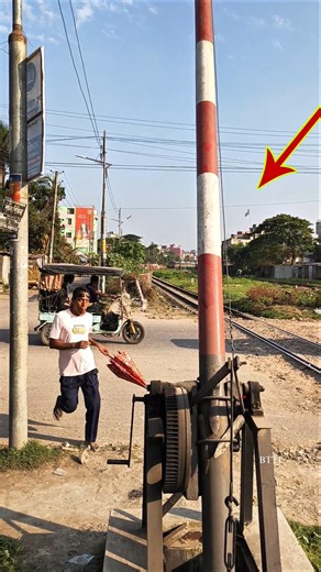 Two railway gates, one gatekeeper, and the train is approaching very closely from this side. #shorts