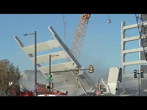 Crews continue demolishing parking garage as city leaders help residents