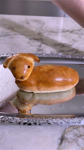 A hot dog served in the cutest little wiener dog bun 🌭🐶✨