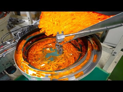 Mass-production of Japanese reflectors inside a bicycle-reflector factory.
