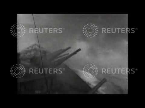 1941 AT SEA: Sixteen inch guns firing on H.M.S. Nelson
