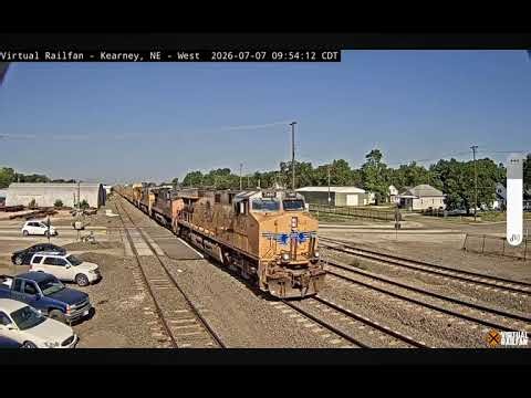 Short UP autorack train (UP 6310) passes the 5th Ave railroad crossing Kearney, Nebraska 7-7-26