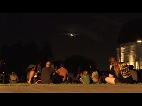 People gather at Los Angeles observatory for deep partial lunar eclipse | AFP