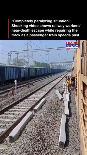 A viral video has raised serious concerns about railway safety after Indian Railways workers were seen repairing an active track as a passenger train approached at high speed. The workers cleared the line just seconds before the train passed, narrowly avoiding a major accident. The footage has sparked widespread outrage online, with many questioning why maintenance was allowed on a live track and demanding accountability from railway authorities. [Railways, Accident, Near death] #NewsWithTN | TI