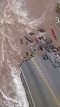 Raging floodwaters wash away road in historic Indiana flooding #shorts