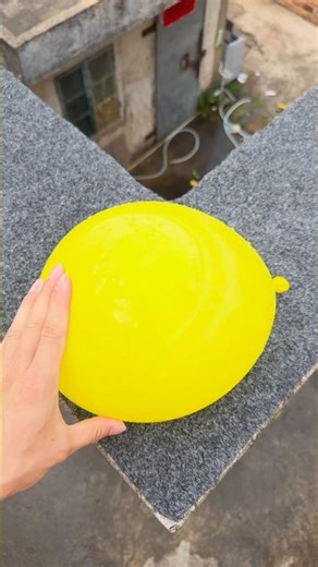 Experiment: Will a water balloon explode if it rolls down a tall building? 💥🎈 #balloon