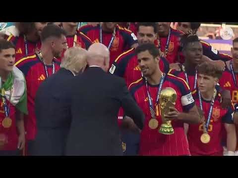 Trump booed at World Cup as he presents Spain FIFA trophy, then lingers for lifting ceremony