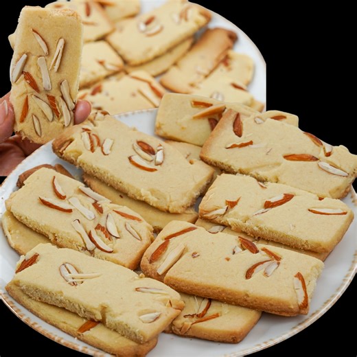 These Badam Almond Stick Biscuits are the perfect combination of crispiness, buttery texture, and rich almond flavor. Whether you're serving them with tea or packing them as edible gifts, these stick-shaped cookies are sure to impress! Made with simple ingredients and packed with the goodness of almonds, this recipe is easy to follow and turns out beautifully every time. Highlights: – Crispy & buttery texture – Rich almond (badam) flavor – Perfect for tea-time or snacks – Great for festivals & g