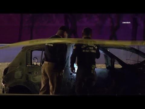 Woman in custody after body found in burning car along Loop 101 overnight