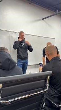 Andy Elliott makes top closer at the Elliott Group take his shirt off during sales meeting!