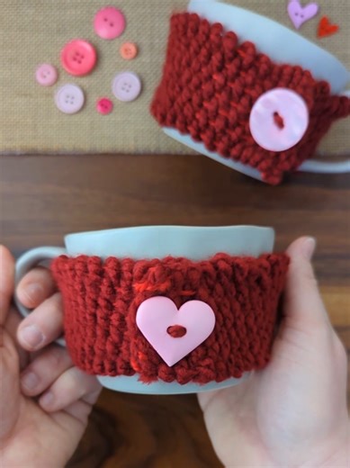 Cardboard Loom Woven Mug Cozy ❤️ Using cardboard and yarn to create this cute DIY Valentine's Day mug! I measured around the mug to find out what length of cloth needed, then cut a piece of cardboard to that size. I cut notches around the top and bottom of the cardboard and wrapped yarn around the cardboard and behind the tabs to create a loom. I cut a popsicle stick on one end, just enough to split the wood, to hold the yarn for weaving. We used the popsicle stick to help guide the yarn while w
