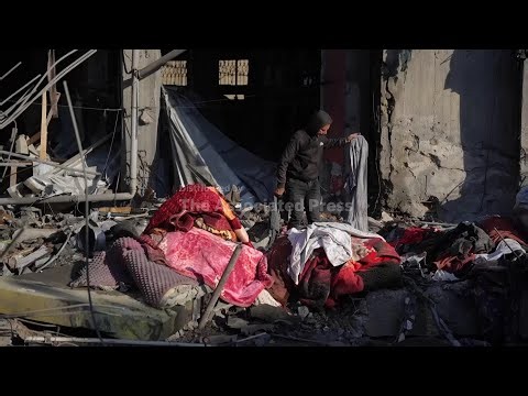 Israeli strikes hit two buildings in central Gaza, hospital officials and residents say