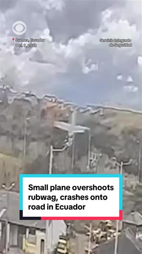 Surveillance footage captured the moment a small plane overshot a runway and crashed onto a road near an airport in Cuenca, Ecuador, Thursday. The aircraft was transporting valuables for Ecuador's Central Bank when it plunged down an embankment. Aviation officials said both people on board were in stable condition. The bank confirmed the valuables were secured following the crash but did not disclose what they were.